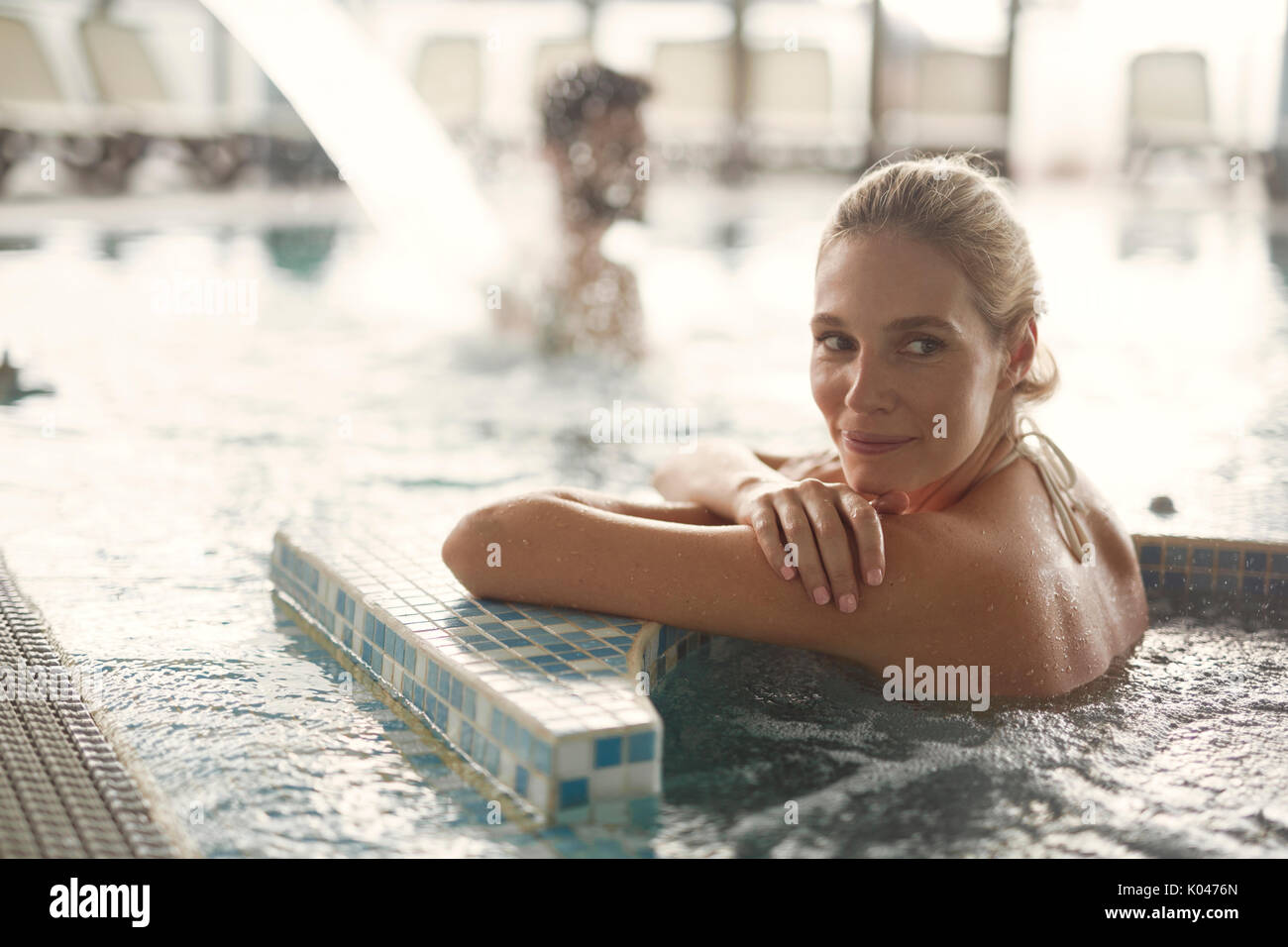 Portrait of beautiful woman relaxing in jacuzzi Stock Photo