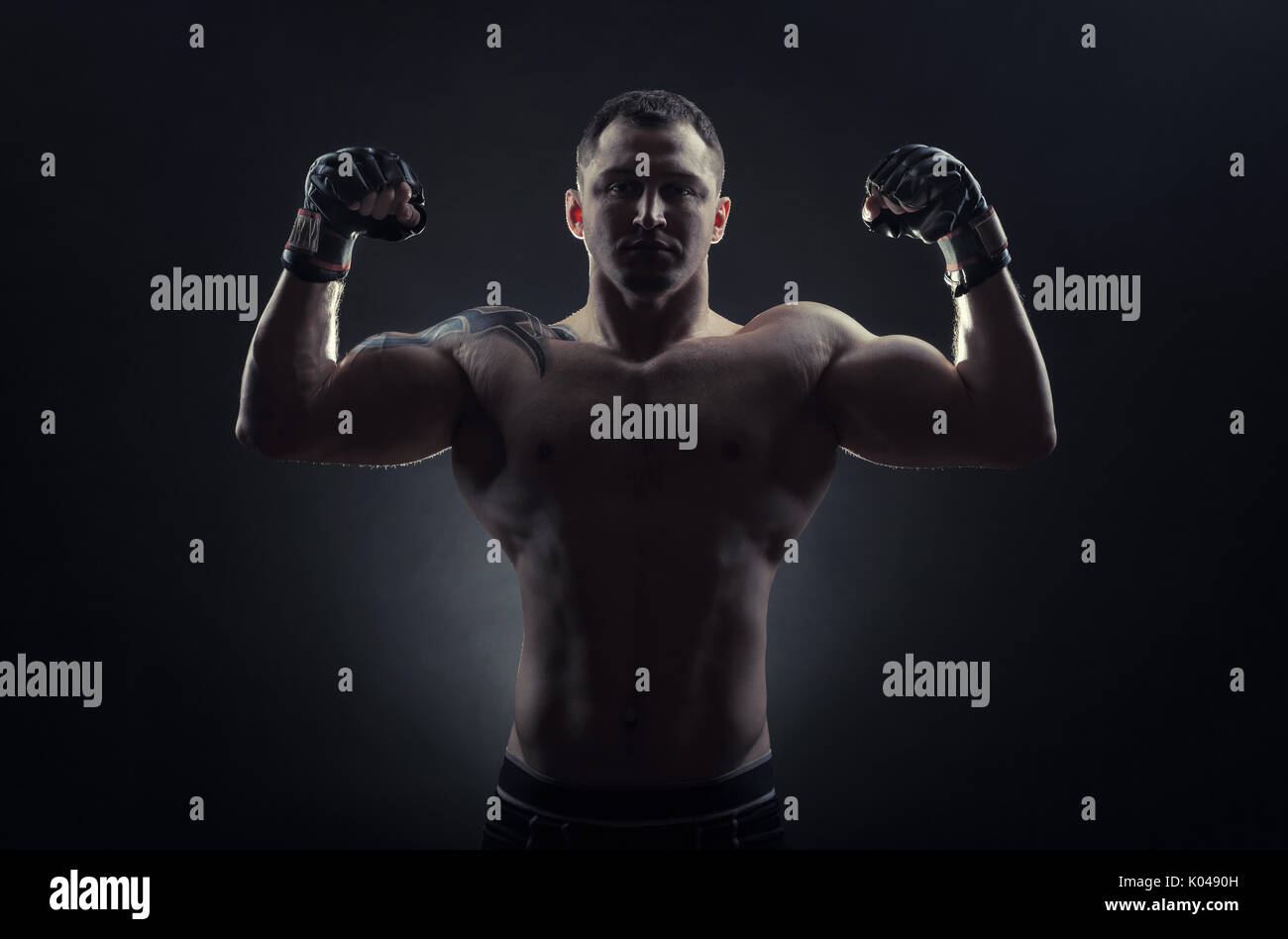 Boxing man ready to fight. Boxer with strong hands in gloves before a