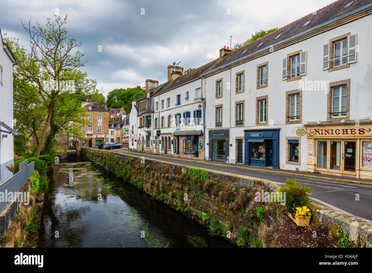 Pont-Aven, France - April 28, 2017: Idyllic scenery at Pont-Aven, street view with small shops, commune in the Finistere department of Brittany (Breta Stock Photo