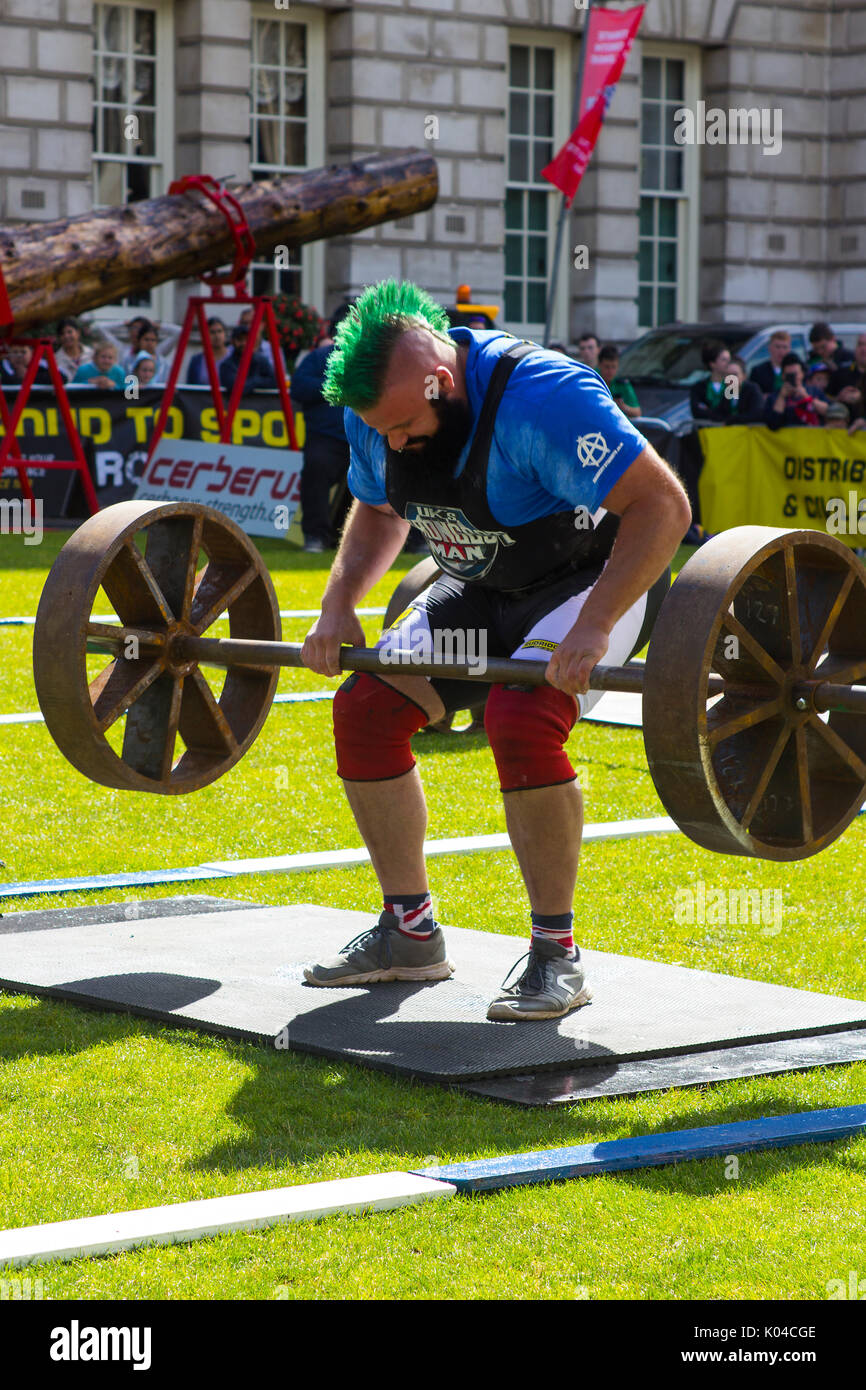 Competitors strain in the power lifting heat of the Ultimate Strongest Man competition that was