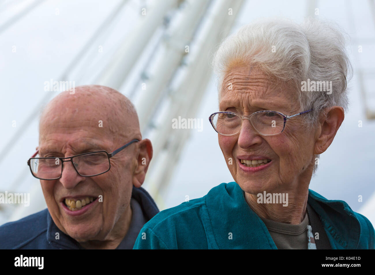 Senior couple in Bournemouth by Big Wheel at Pier Approach, Bournemouth, Dorset, UK in August Stock Photo