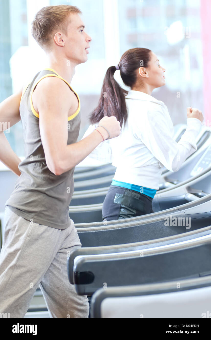 Woman and man at the gym exercising Stock Photo - Alamy