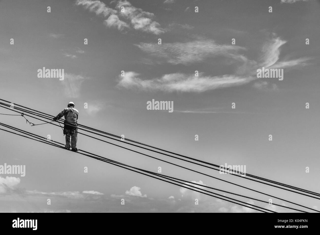 Worker on High Wire Stock Photo