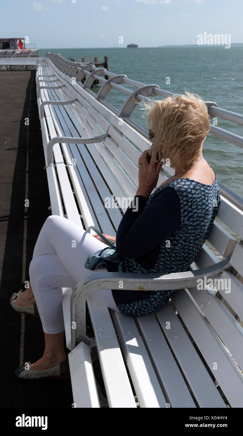 Person sitting alone seaside hi-res stock photography and images - Alamy