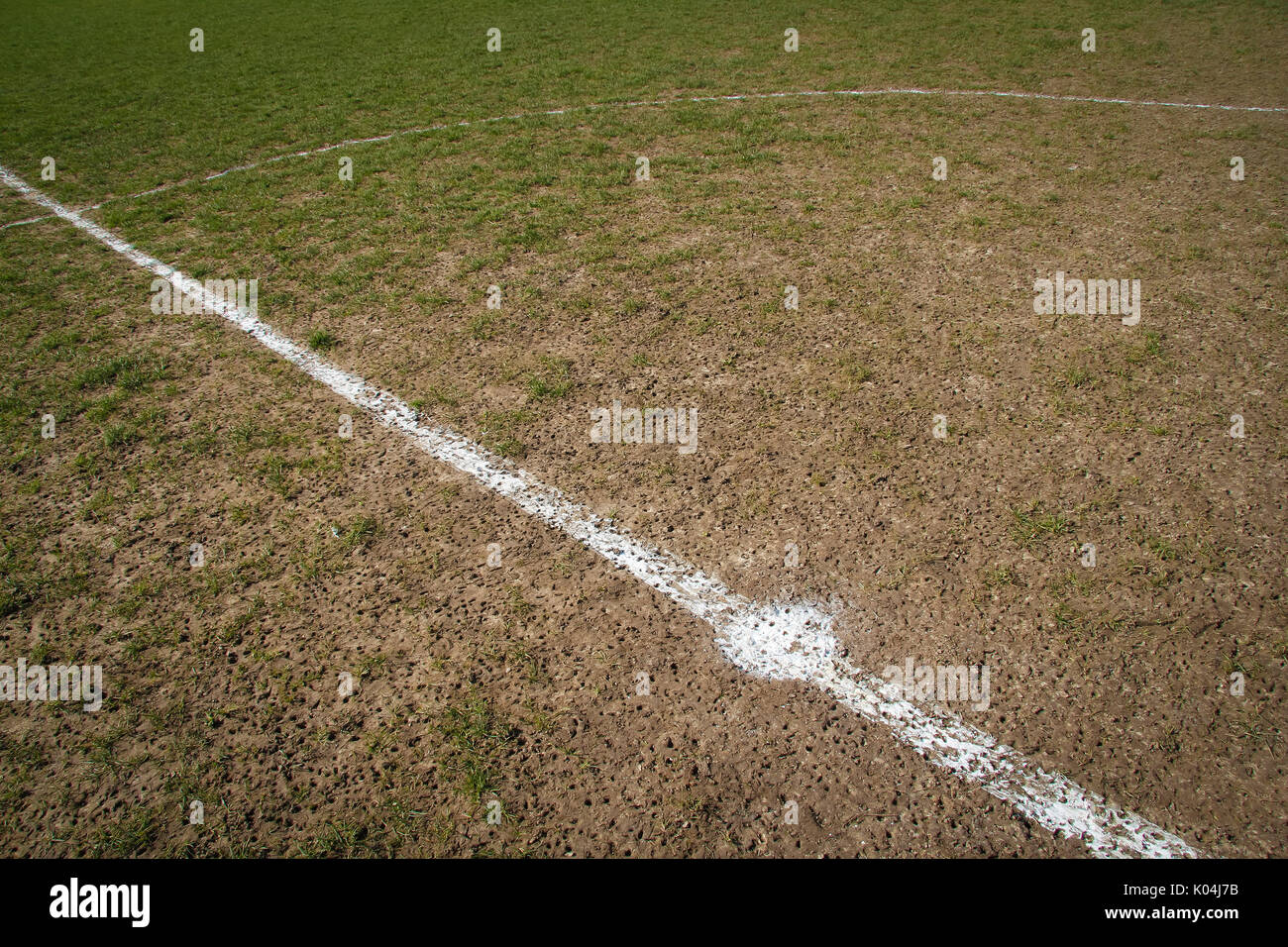 Stud marks on muddy pitch Stock Photo