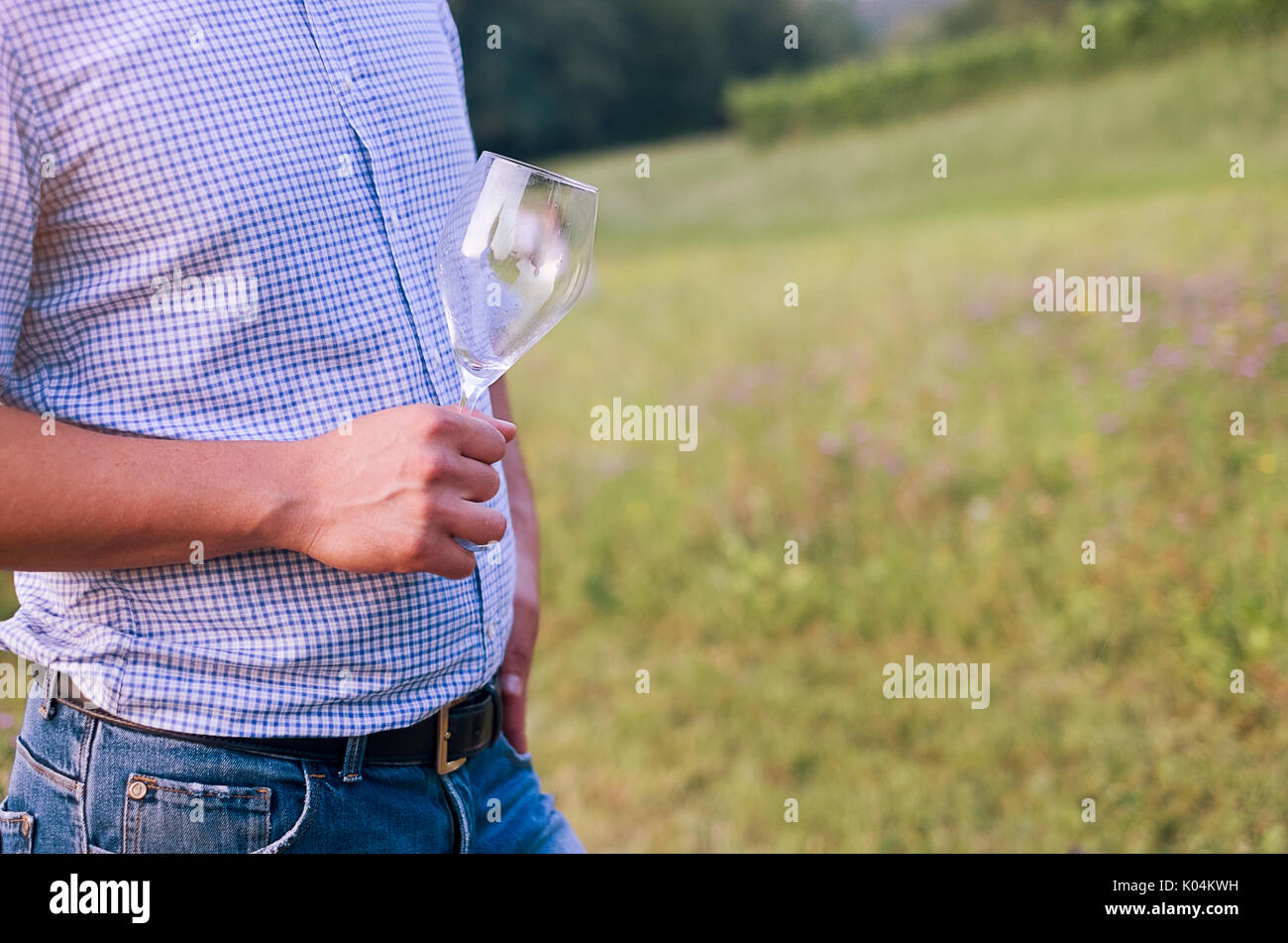 Expert winemaker tasting wine in the countryside Stock Photo