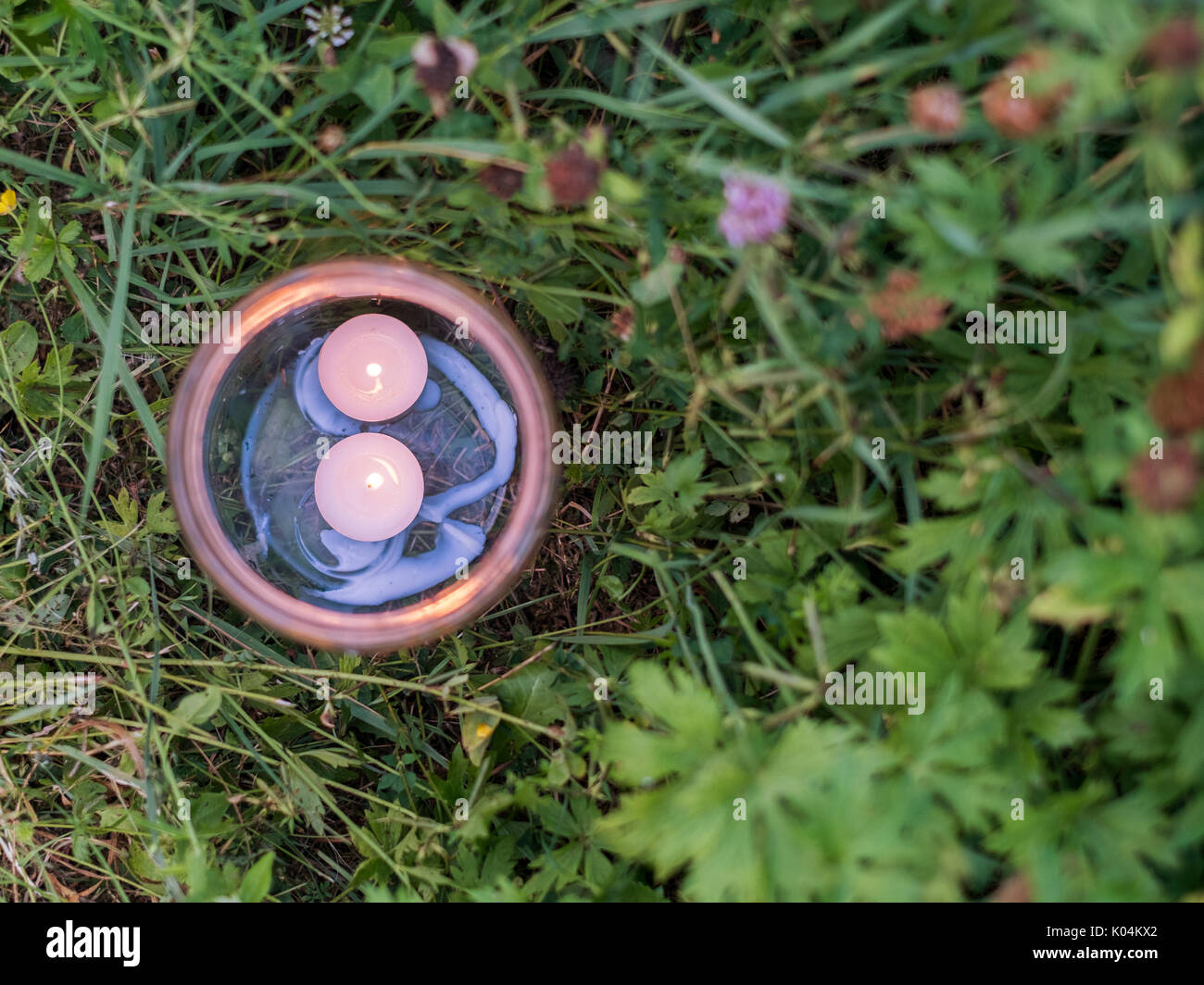 Little candle lamp in the garden grass Stock Photo Alamy