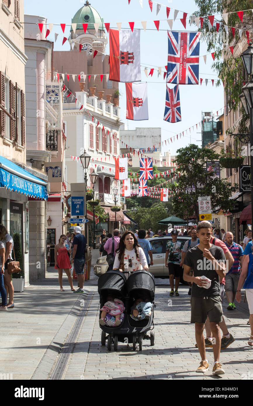 People strolling along Main Street in the UK dependency of Gibraltar
