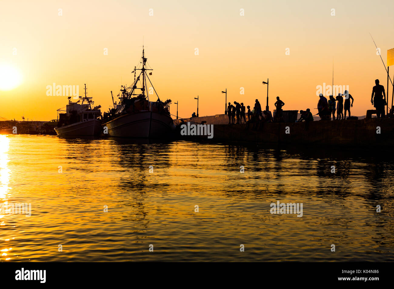 Silhouette fisherman on pier sunset hi-res stock photography and images -  Page 3 - Alamy