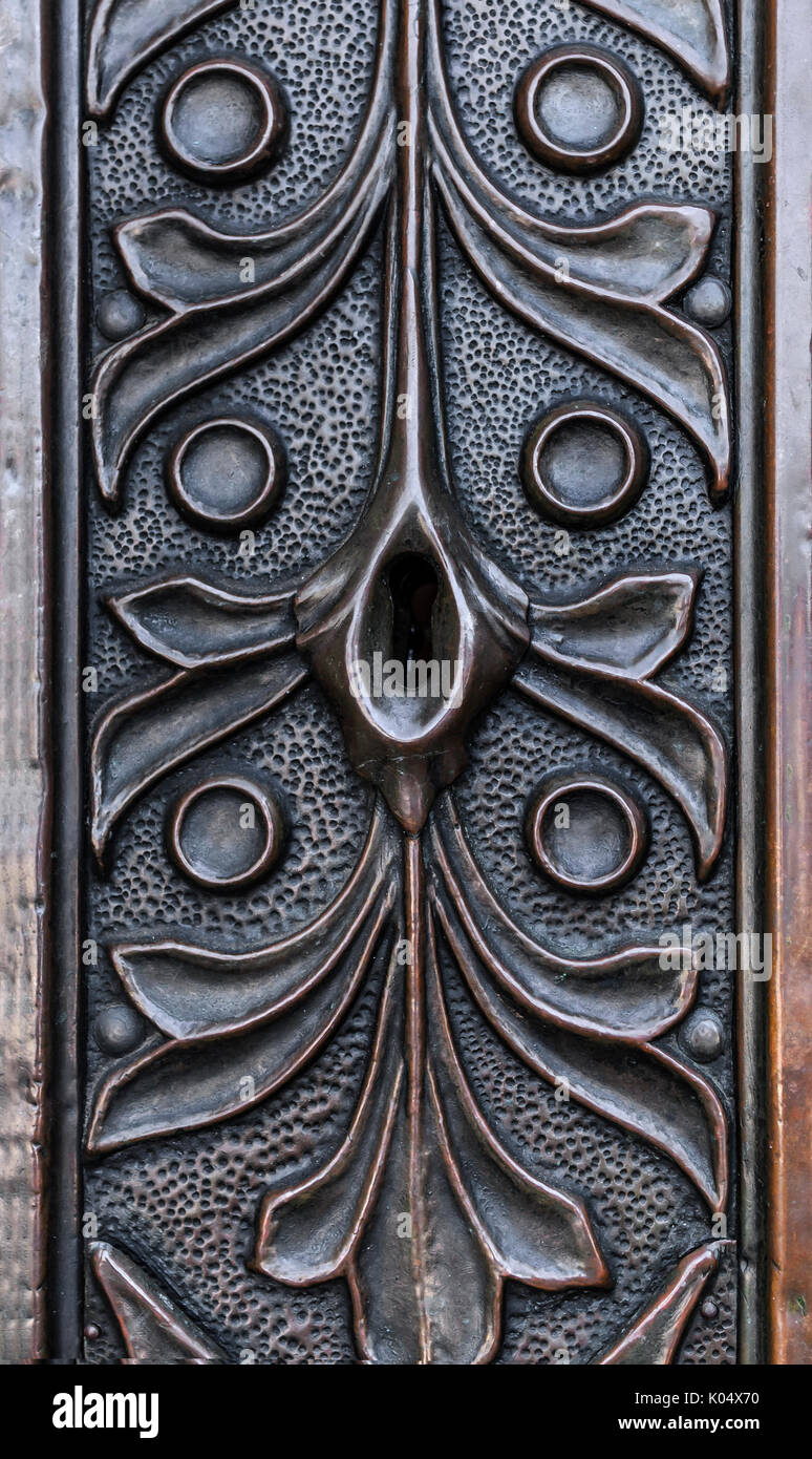 Keyhole in forged door. Stock Photo