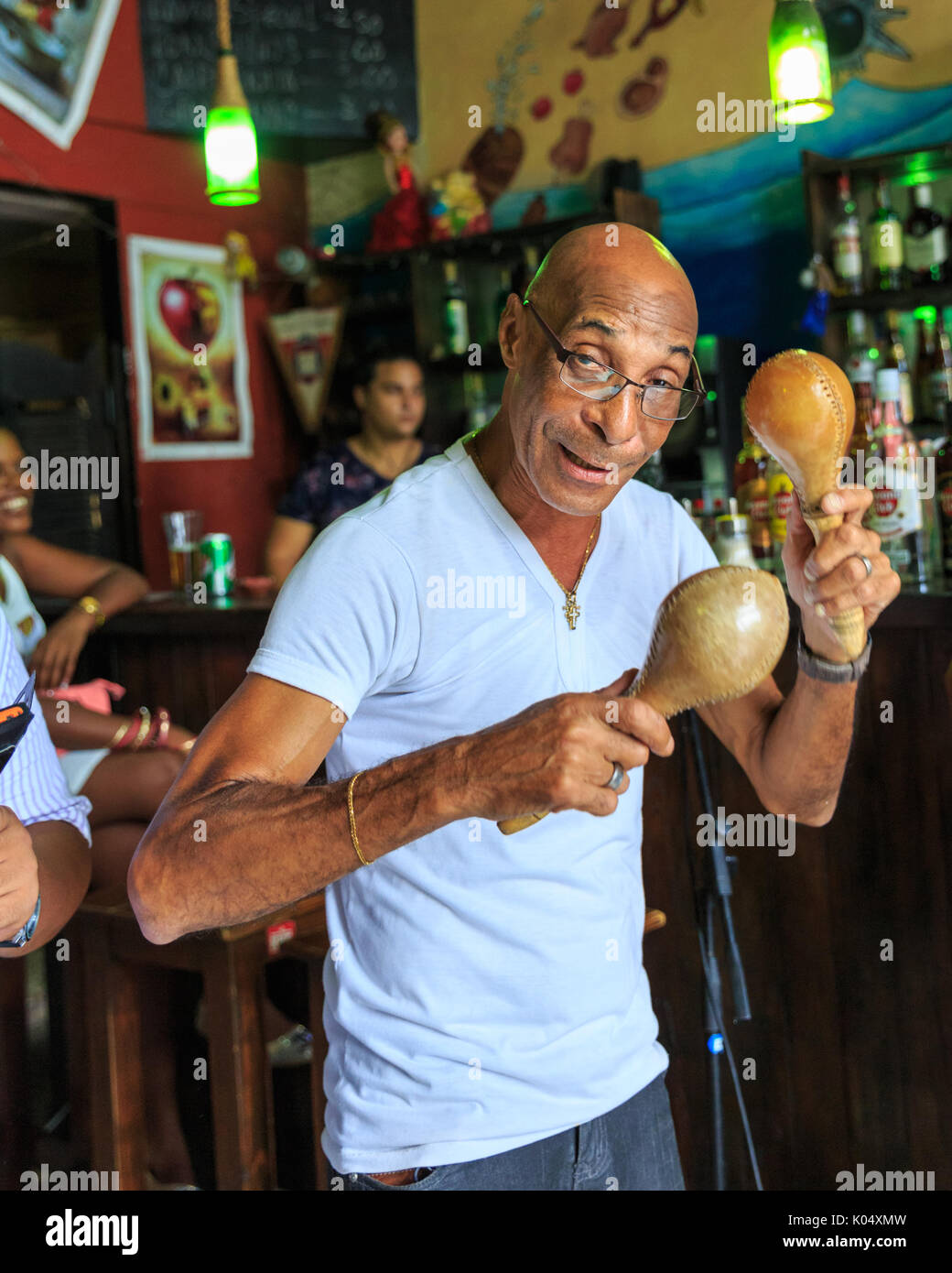 Cuban musician playing maracas with band in latin music salsa bar, La  Habana Vieja, Havana, Cuba Stock Photo - Alamy
