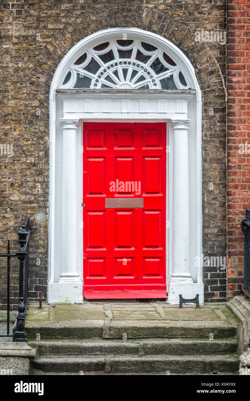 Red classic door in Dublin, example of georgian typical architecture of Dublin, Ireland Stock Photo