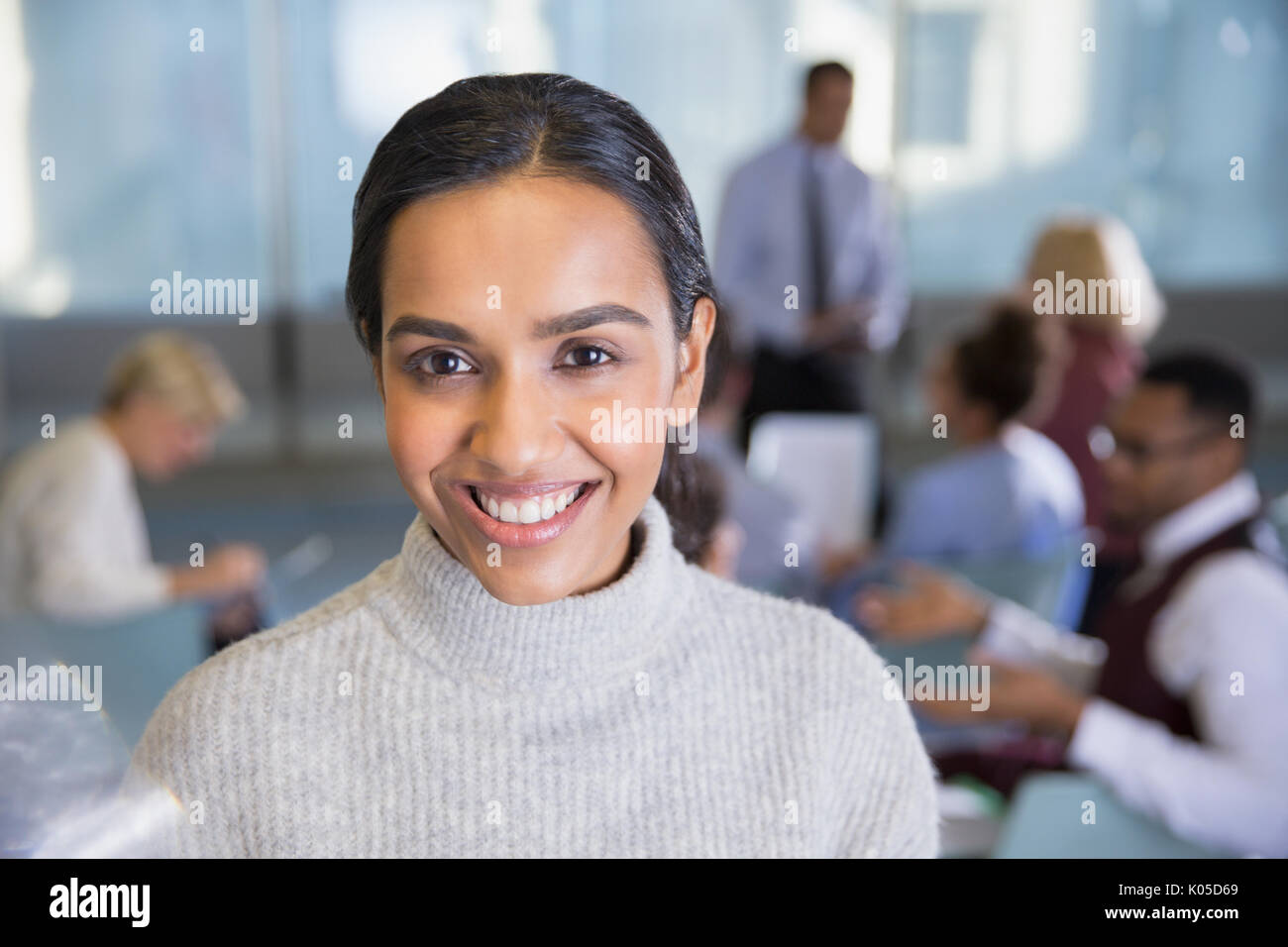 Portrait smiling businesswoman in conference room meeting Stock Photo
