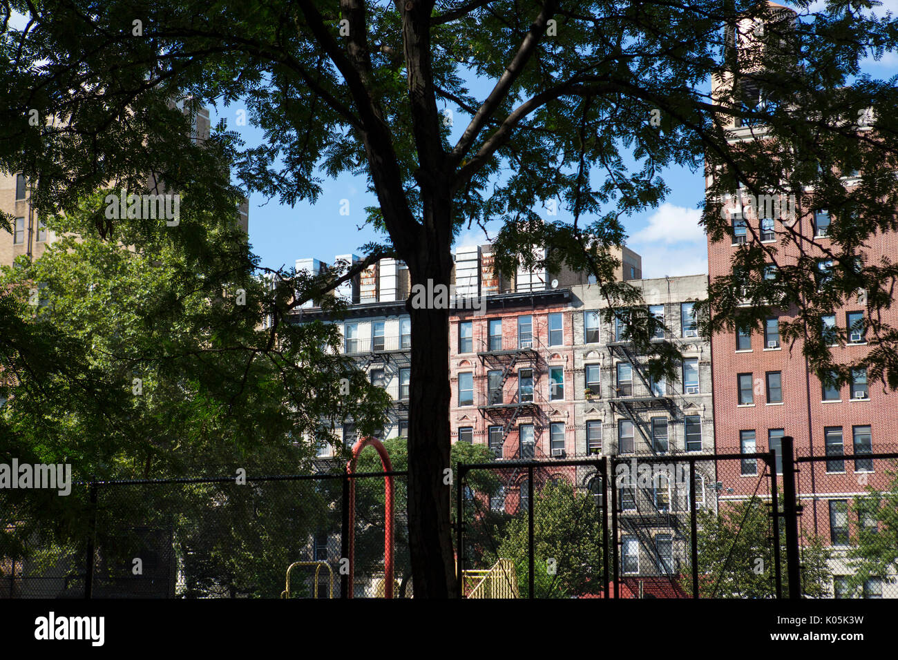 Fire escape ladders on the exterior of New York City apartments in a