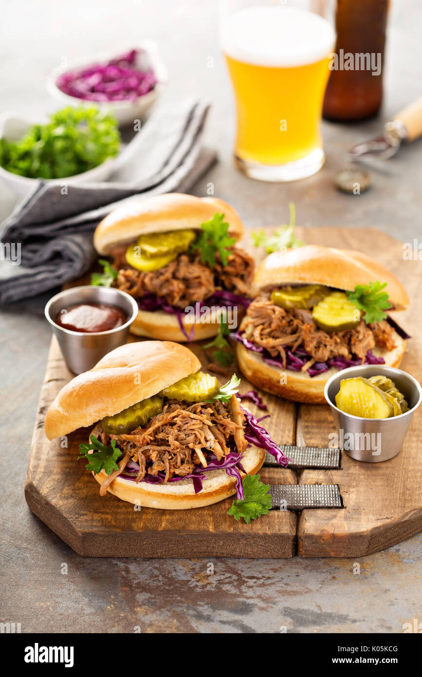 Pulled pork sandwiches with cabbage and pickles Stock Photo