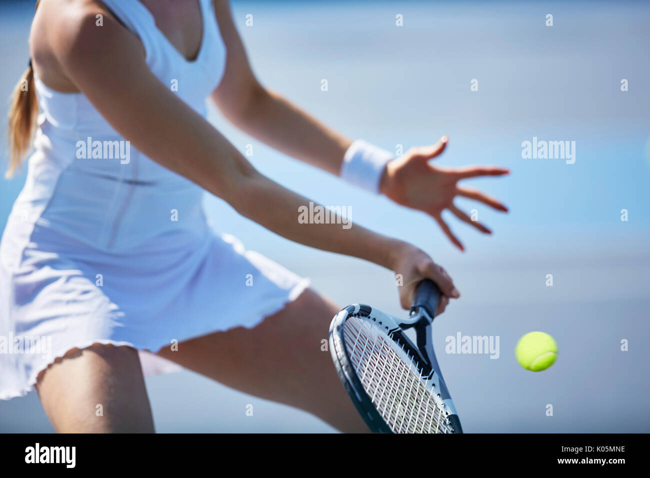 Female tennis player playing tennis, holding tennis racket Stock Photo