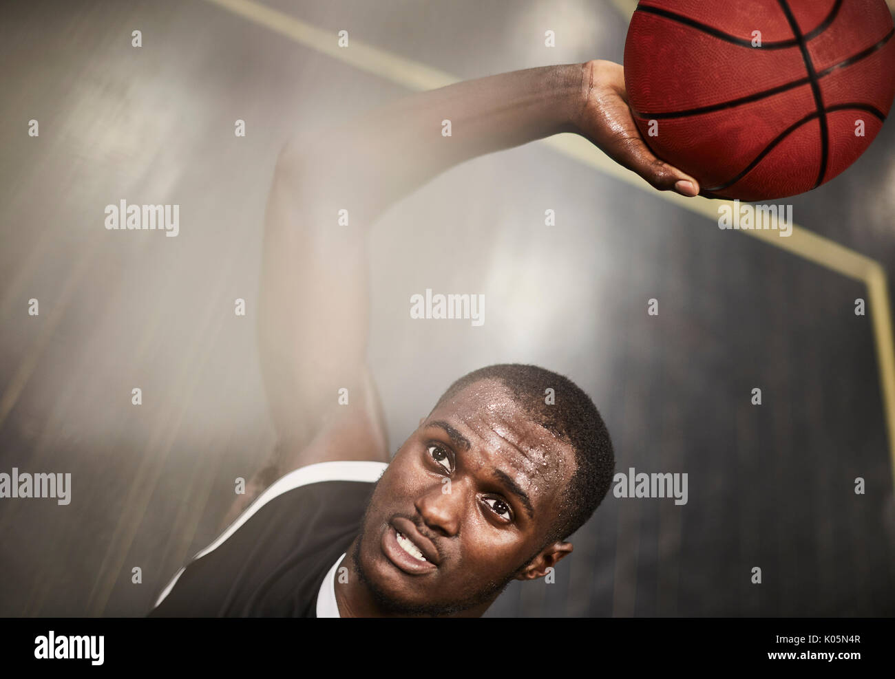 Overhead view determined young male basketball player shooting the ball Stock Photo