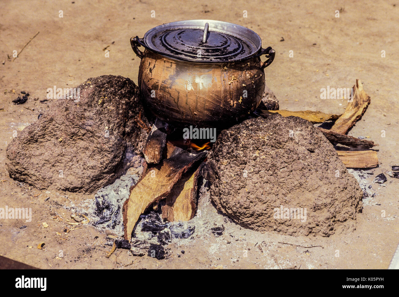 Odienne, Cote d'Ivoire, Ivory Coast, West Africa.  Food Cooking over a Wood Fire. Stock Photo