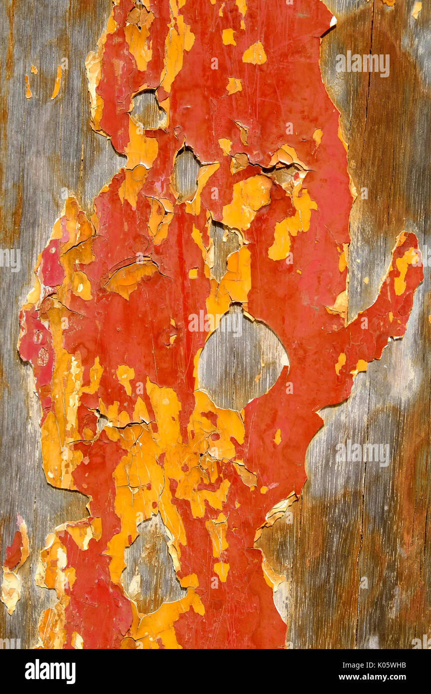 weathered painted wooden board with old flaky paint Stock Photo