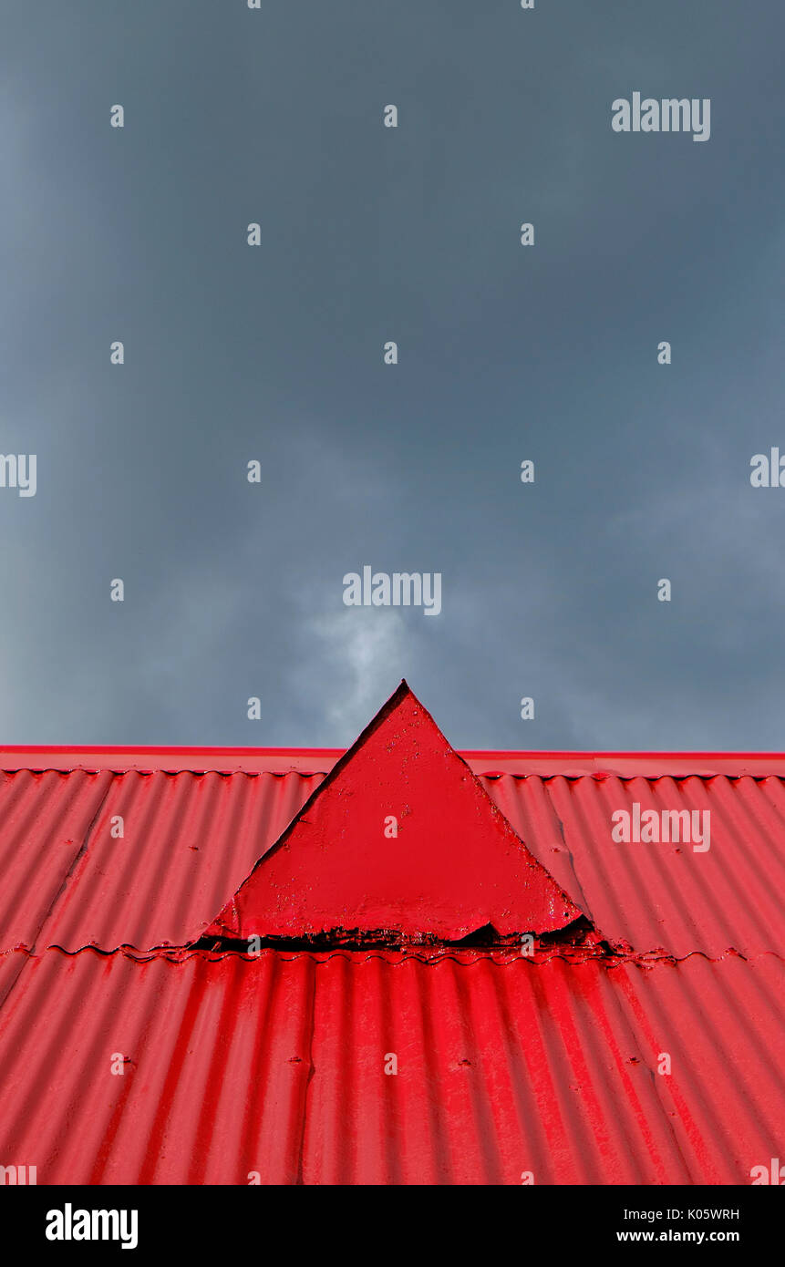 red painted corrugated metal roof on old chapel building Stock Photo