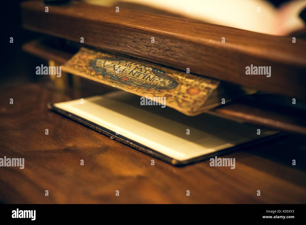 Spine of a book with illustration reading 'For my Valentine' between two panels of wood, 2016. Stock Photo