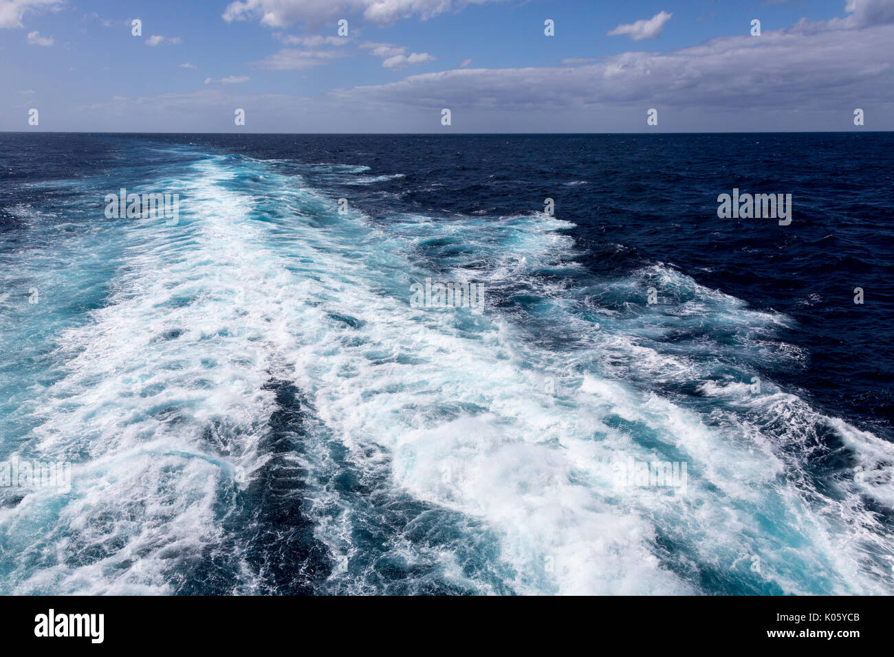 A Ship's Wake in the Caribbean Sea.  Calm Sea, Far Horizon. Stock Photo