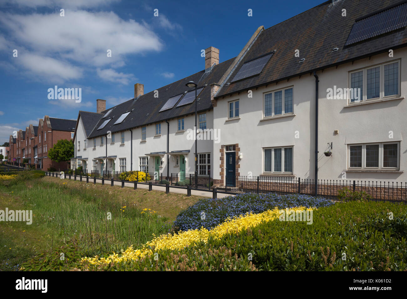 Modern terraced housing with solar panels on roof forming part of the modern Eco design development of Upton, a suburb of Northampton, England, UK Stock Photo