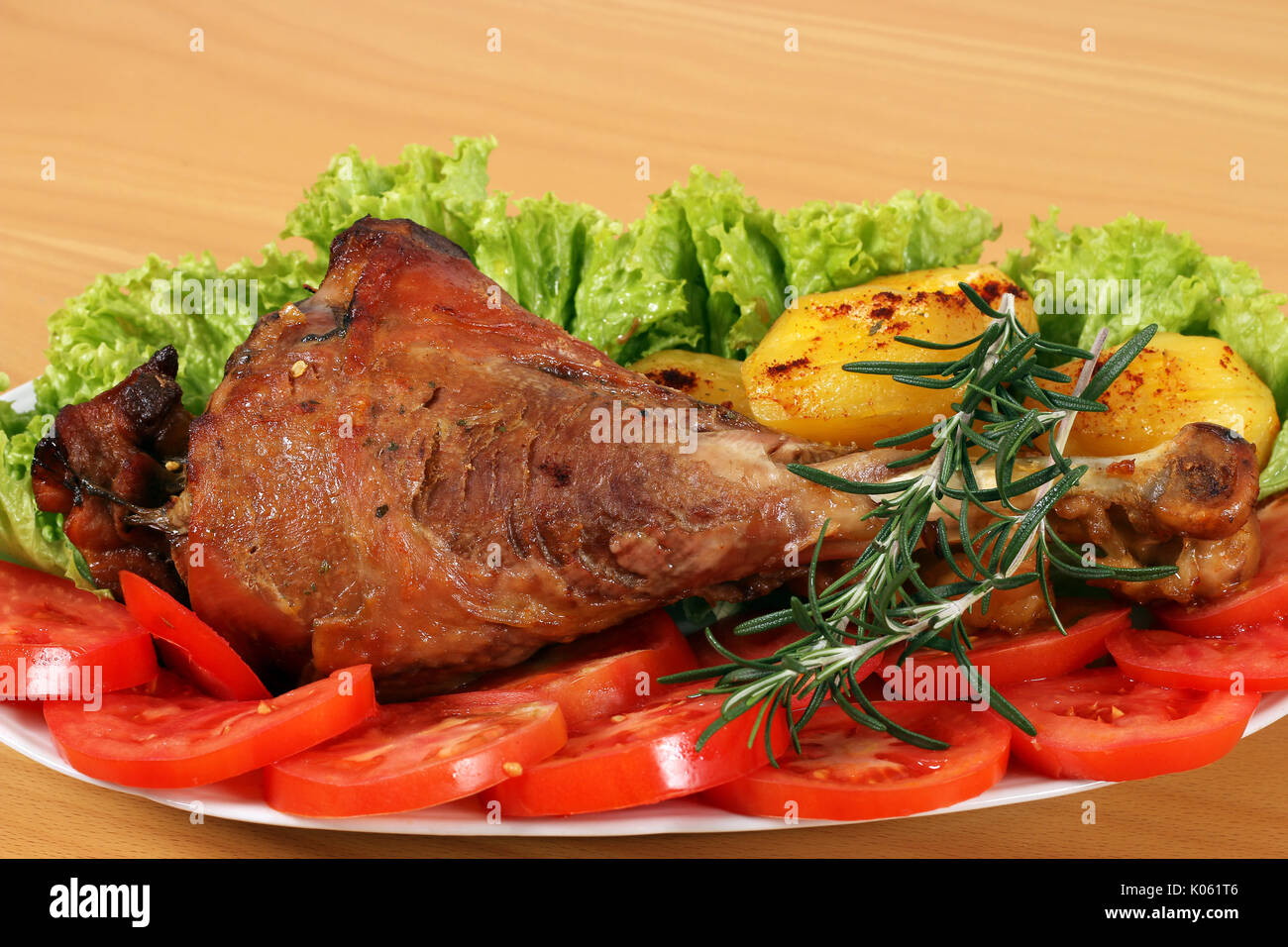 big turkey drumstick with potatoes and salad Stock Photo