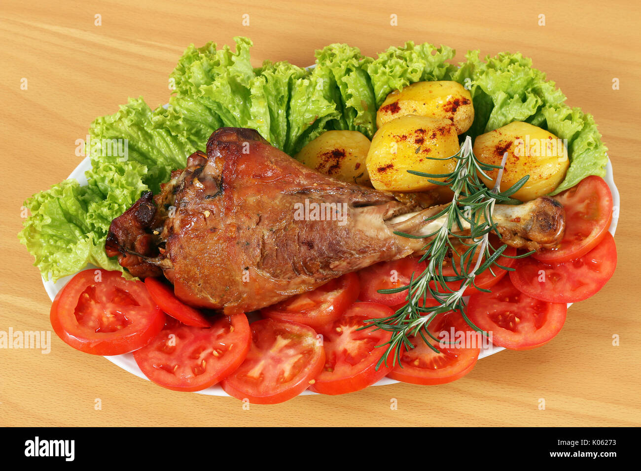 turkey drumstick with potatoes and salad Stock Photo