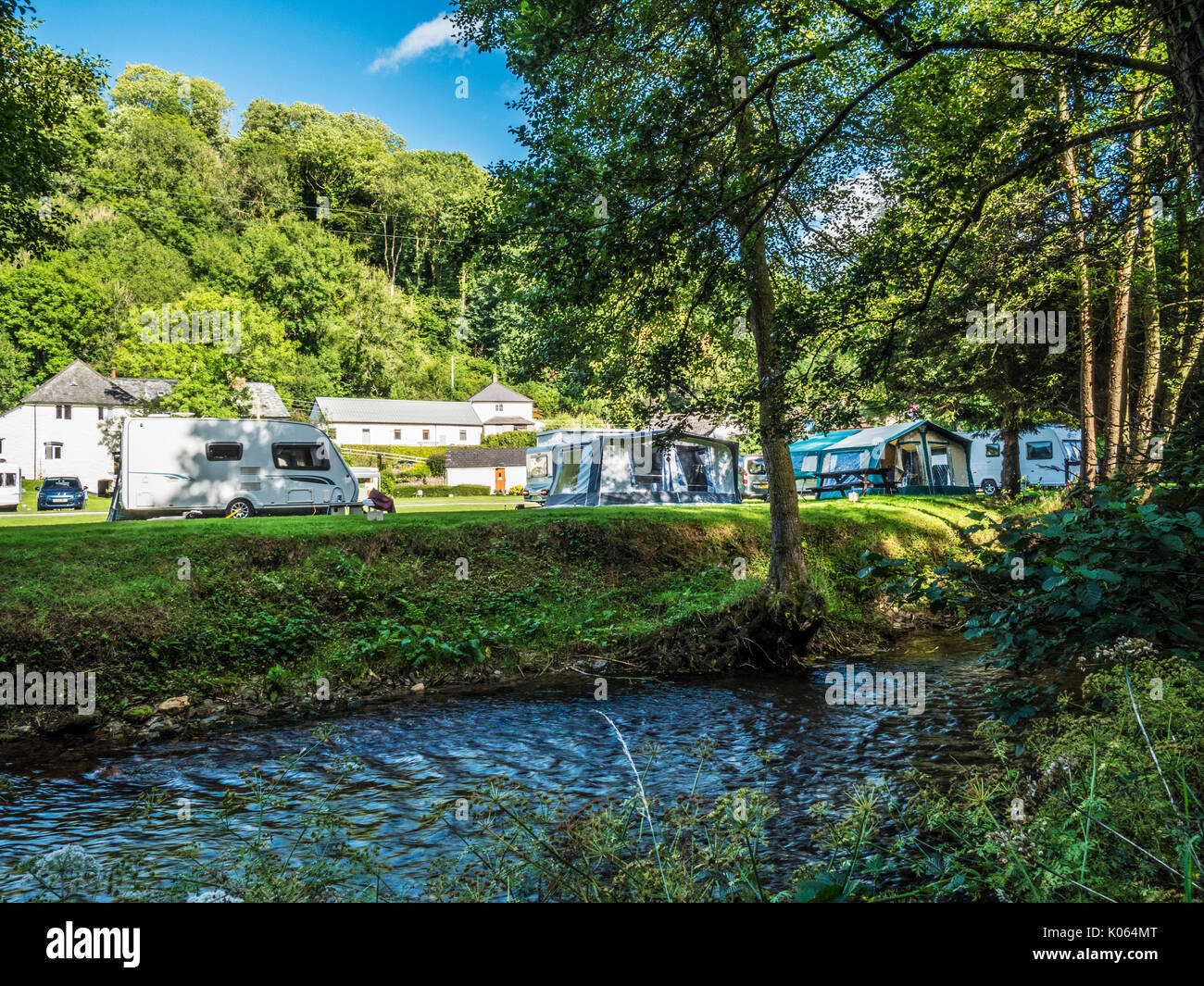 A small caravan site along the banks of the River Exe in Exmoor, Somerset. Stock Photo