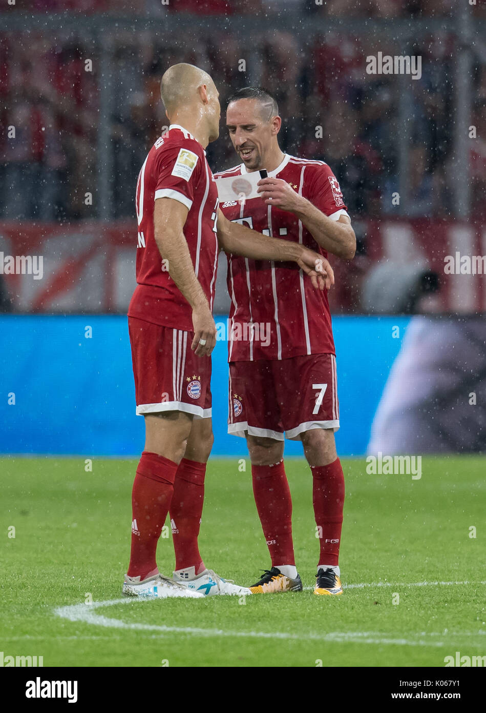 Robben And Ribery Munich's Franck Ribery (r) gives his captain's arm band to Arjen Robben ...