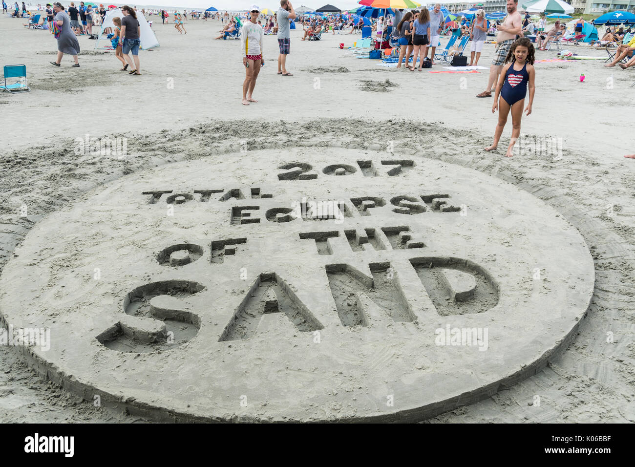 Charleston, Isle of Palms, USA. 21st Aug, 2017. A sand design celebrating the total solar eclipse as thousands gather on the beach outside Charleston August 21, 2017 in Isle of Palms, South Carolina. The solar eclipse after sweeping across the nation crosses the Charleston area before heading over the Atlantic Ocean. Credit: Planetpix/Alamy Live News Stock Photo