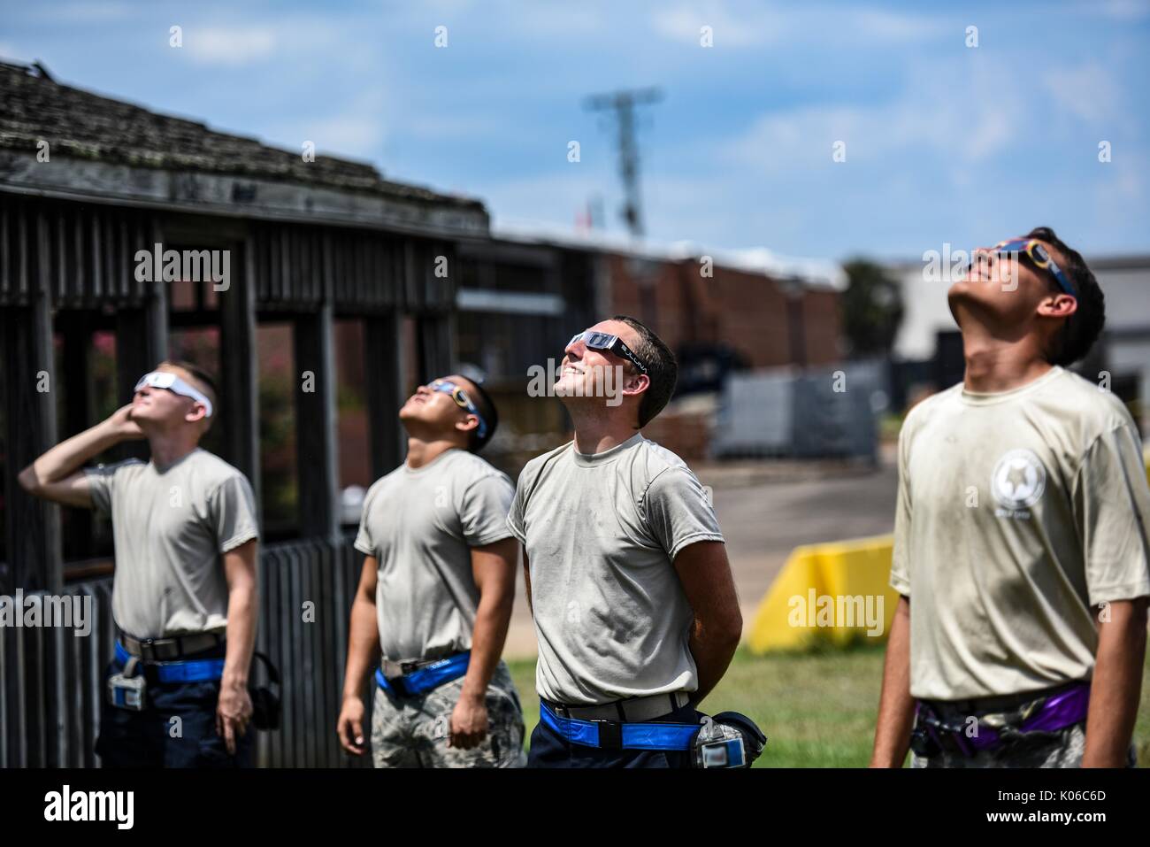 Richland, United States Of America. 21st Aug, 2017. U.S. Air Force airmen watch the total solar eclipse wearing special glasses at McEntire Joint National Guard Base August 21, 2017 in Richland County, South Carolina. The total eclipse swept across a narrow portion of the contiguous United States from Oregon to South Carolina and a partial solar eclipse was visible across the entire North American continent along with parts of South America, Africa, and Europe. Credit: Planetpix/Alamy Live News Stock Photo