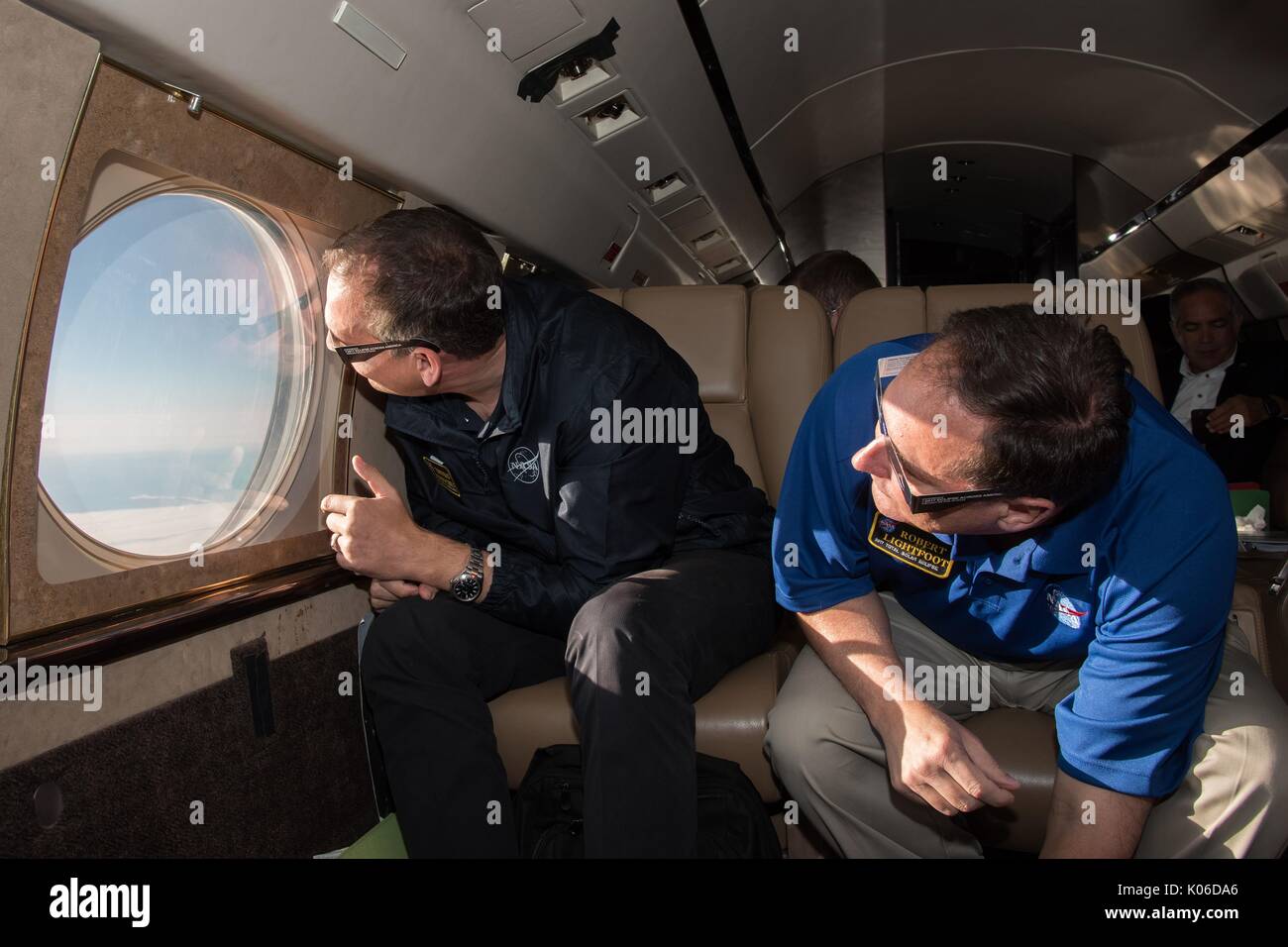 Acting NASA administrator Robert Lightfoot, right, and NASA Associate Administrator for the Science Mission Directorate Thomas Zurbuchen view the solar eclipse from onboard a NASA Armstrong Flight Research Center's Gulfstream III August 21, 2017 flying 35,000 feet above the Oregon Coast. The total eclipse swept across a narrow portion of the contiguous United States from Oregon to South Carolina and a partial solar eclipse was visible across the entire North American continent along with parts of South America, Africa, and Europe. Stock Photo