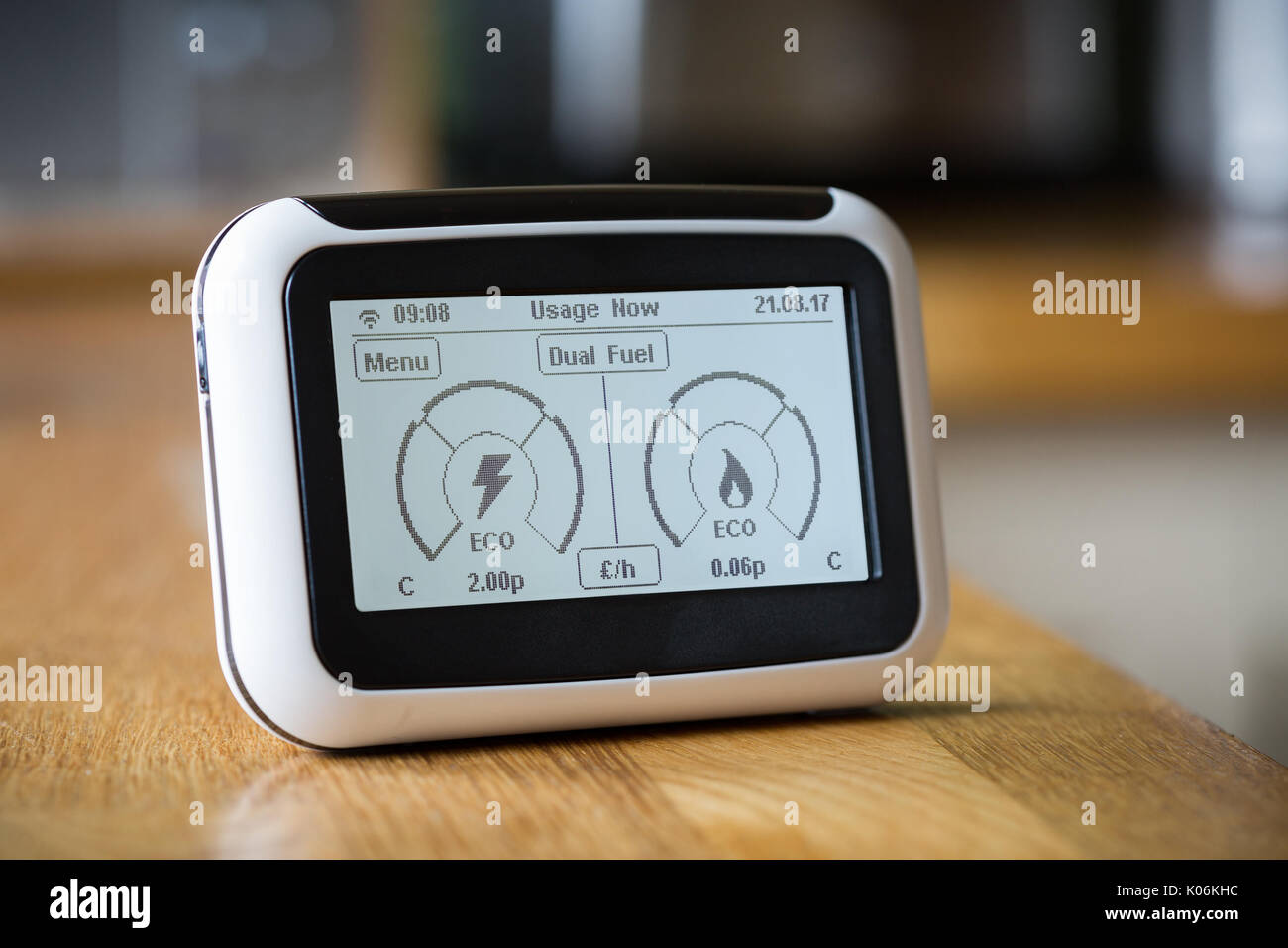 Smart Meter on a Kitchen Worktop Displaying Current Electricity and Gas Usage Stock Photo