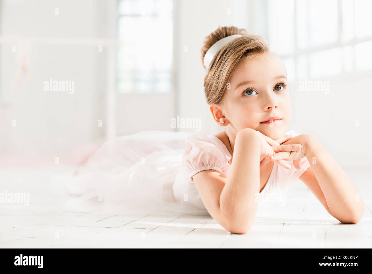 The little balerina in white tutu in class at the ballet school Stock Photo