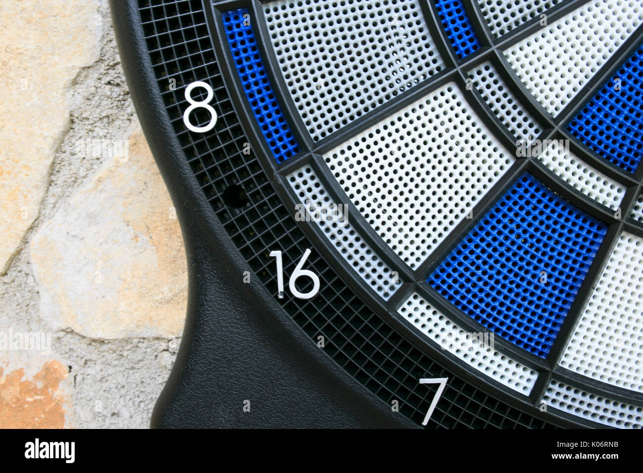Bullseye on a wall with some darts Stock Photo