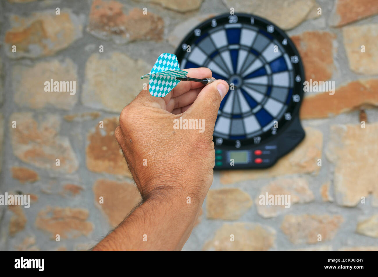 Bullseye on a wall with some darts Stock Photo