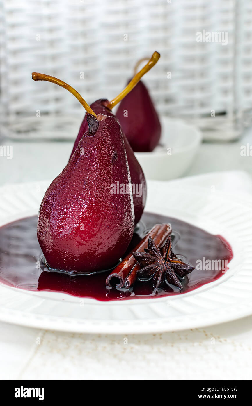 Pears poached in red wine, with star anise Stock Photo Alamy