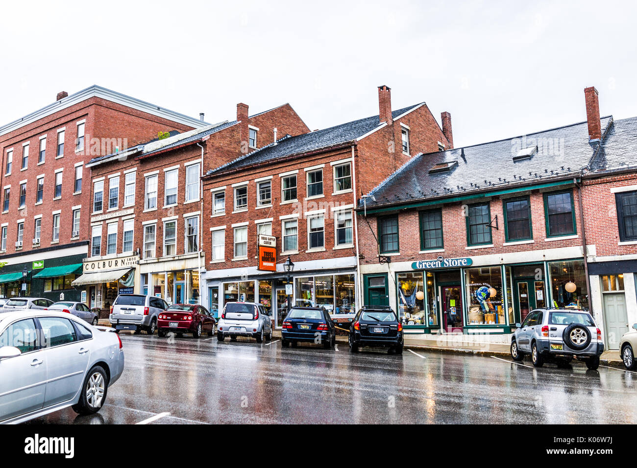 Belfast, USA - June 9, 2017: Empty small village in Maine during rain with stores on steep hill main street Stock Photo