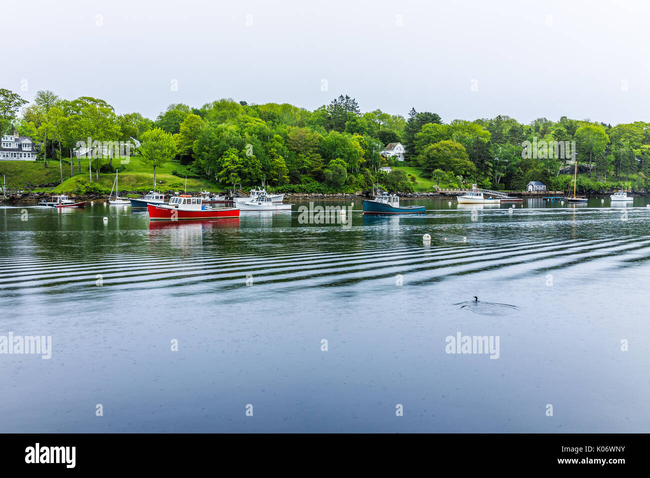 Rockport, USA - June 9, 2017: Empty marina harbor in small village in Maine during rain with boats Stock Photo