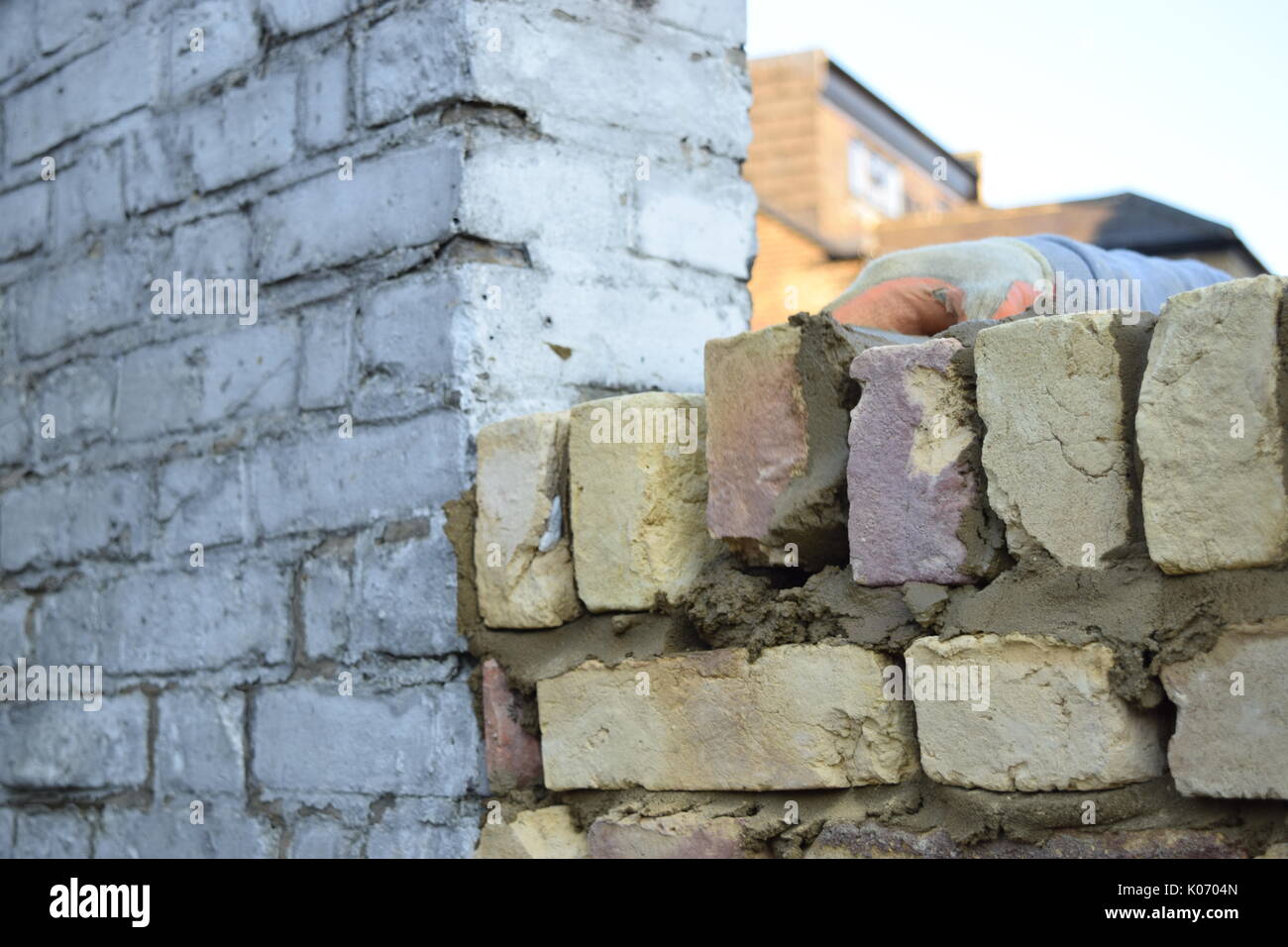 Male worker laying bricks Stock Photo