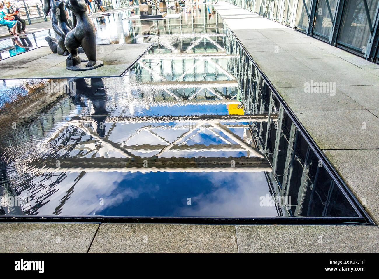 Water reflections of art and architecture at the Centre Pompidou Stock Photo