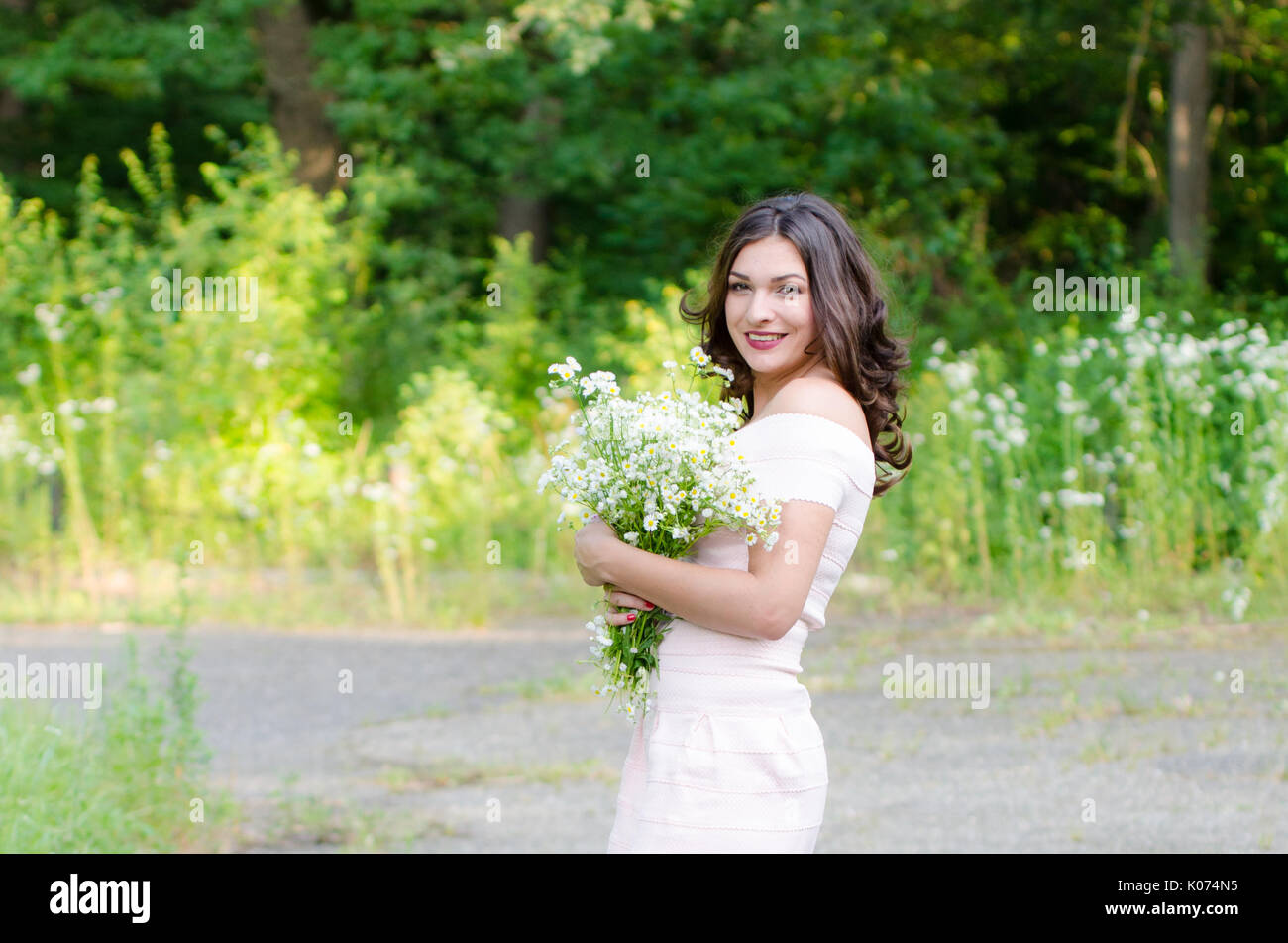 Portrait of a beautiful young girl on nature Stock Photo - Alamy