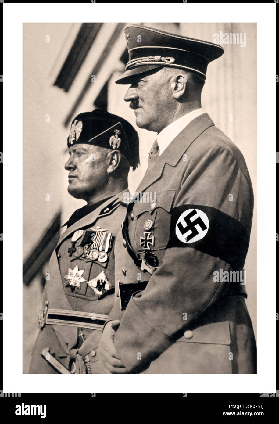 1940 GERMAN PROPAGANDA WW2 Adolf Hitler and Benito Mussolini take a troop parade salute in Munich in 1940 Stock Photo