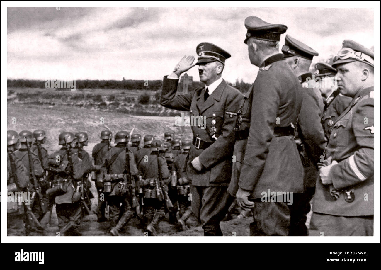 ADOLF HITLER POLAND INVASION OCCUPATION  Adolf Hitler saluting marching Wehrmacht troops during occupation of Poland 1939 World War 2 Stock Photo