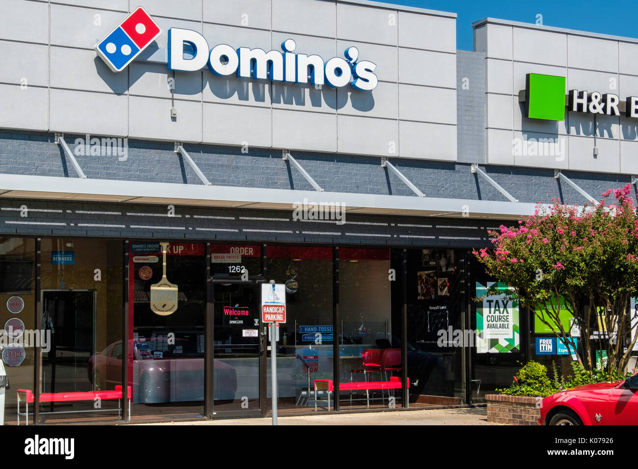 Exterior oblique view of the storefront of a Domino's Pizza restaurant serving pizza pie in Norman, Oklahoma, USA. Stock Photo