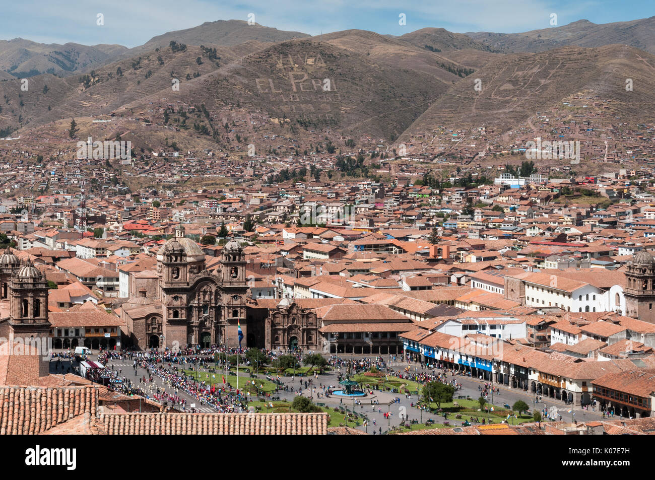 A view over Plaza de Armas, the historic centre of Cusco, and surrounding mountains covered in inscriptions, Peru. Stock Photo