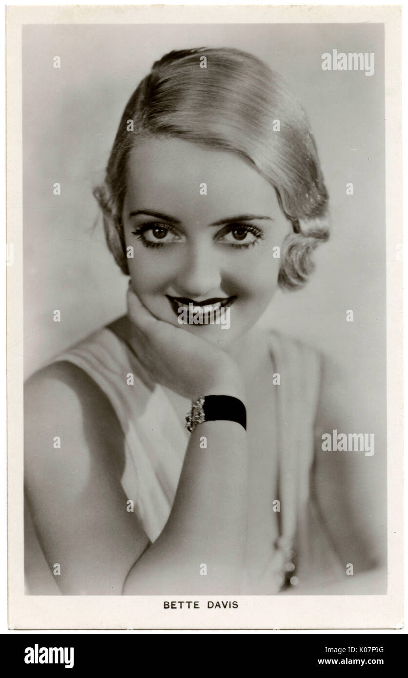 Bette Davis (1908 - 1989), American film actress, resting her chin on her hand      Date: Stock Photo