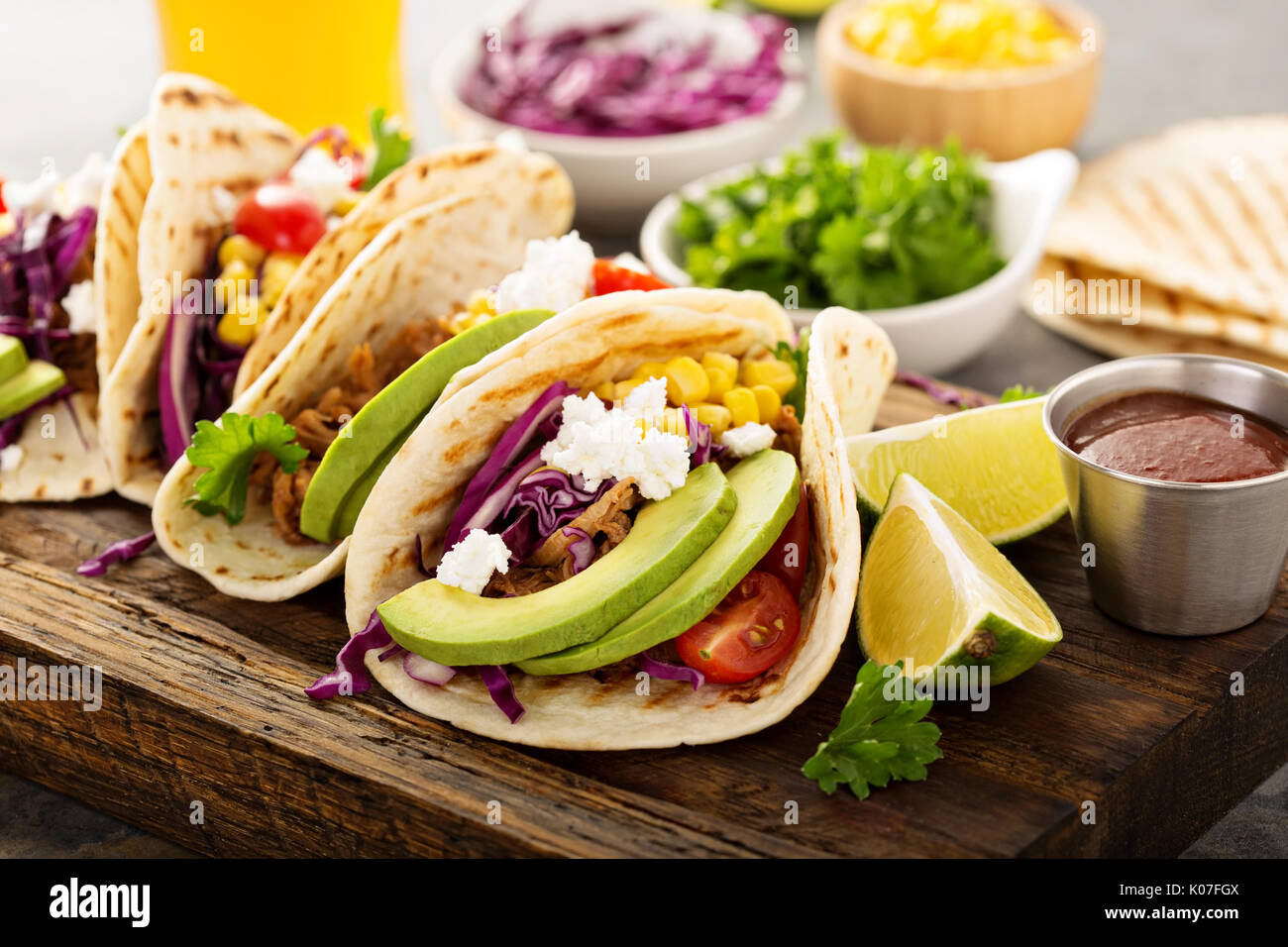 Pulled pork tacos with red cabbage and avocados Stock Photo Alamy